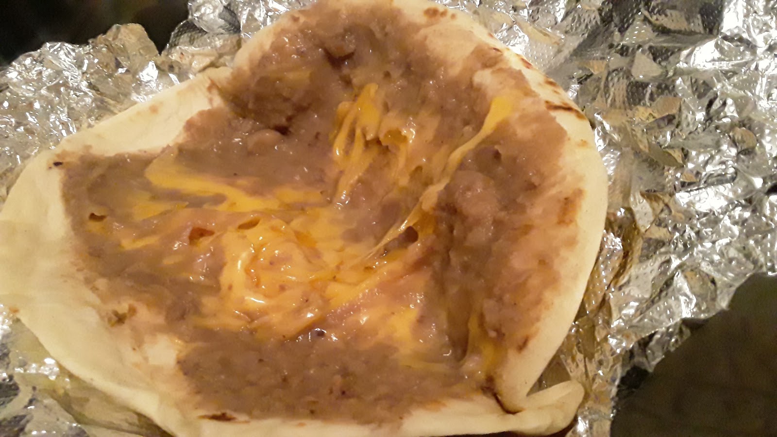 Bean and cheese taco with melted cheese