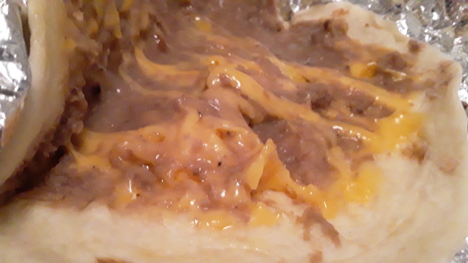 Bean and cheese taco filling close up